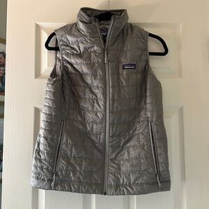 Silver Patagonia Vest. “Embroidered on back”